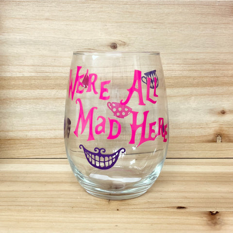 We’re All Mad Here Stemless Wine Glass - Pink Text