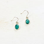 Sterling Silver Created Emerald Oval Dangle Earrings