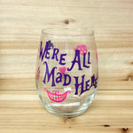We’re All Mad Here Stemless Wine Glass - Purple Text